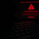 A dimly lit scene featuring a keyboard in the