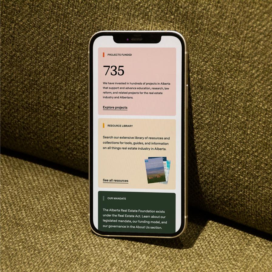 iPhone displaying a part of the AREF website's homepage.