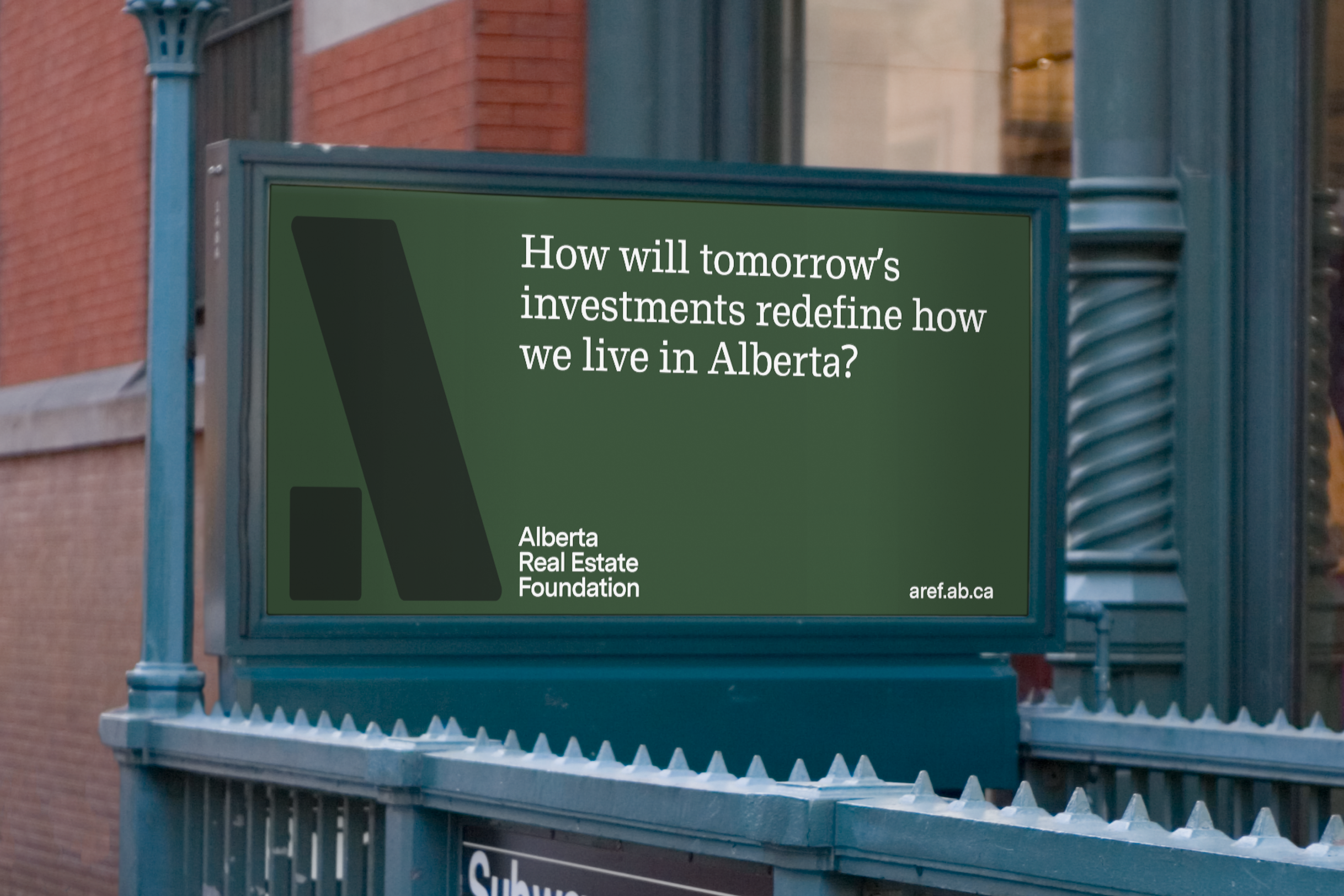 A billboard sign for AREF in green.