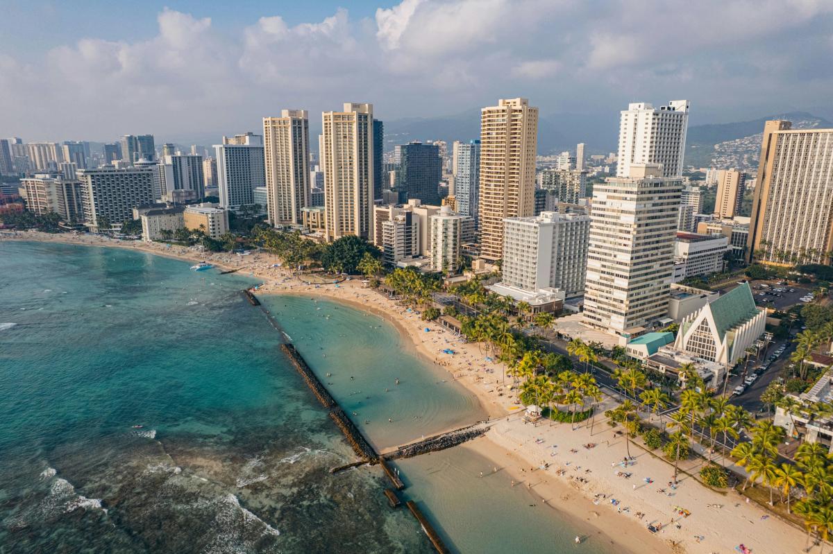 Aerial view of coastal city with beach and high-rises