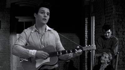 A man playing acoustic guitar