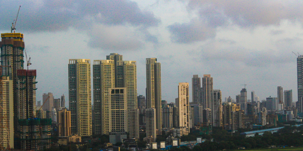 NRI Real Estate Investment India: FD, Flat, REIT or Fractional Ownership?