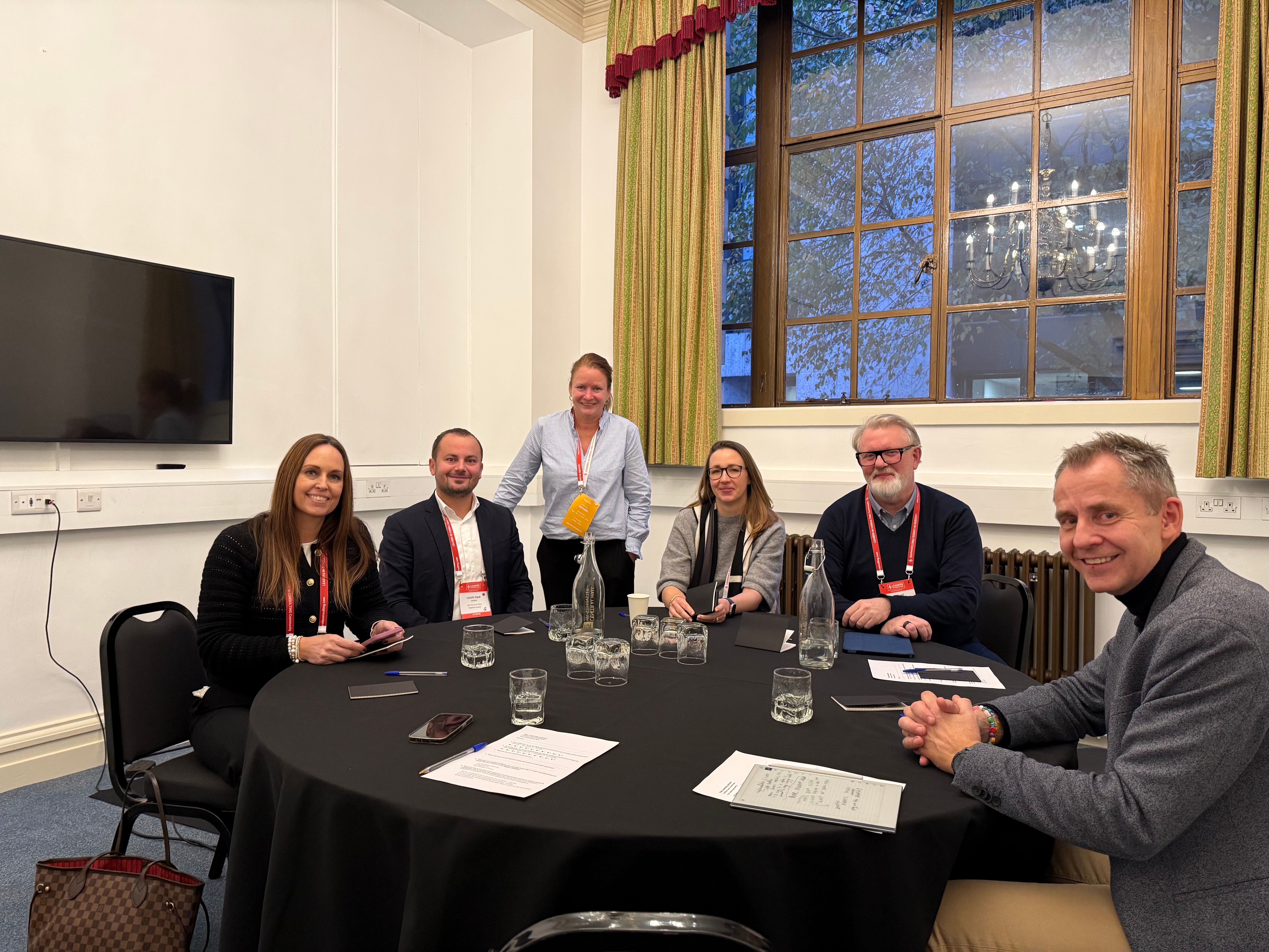 Consulting leaders engaging in a hands-on strategy session at Leaders in Consulting Conference 2025, discussing real-world business growth challenges
