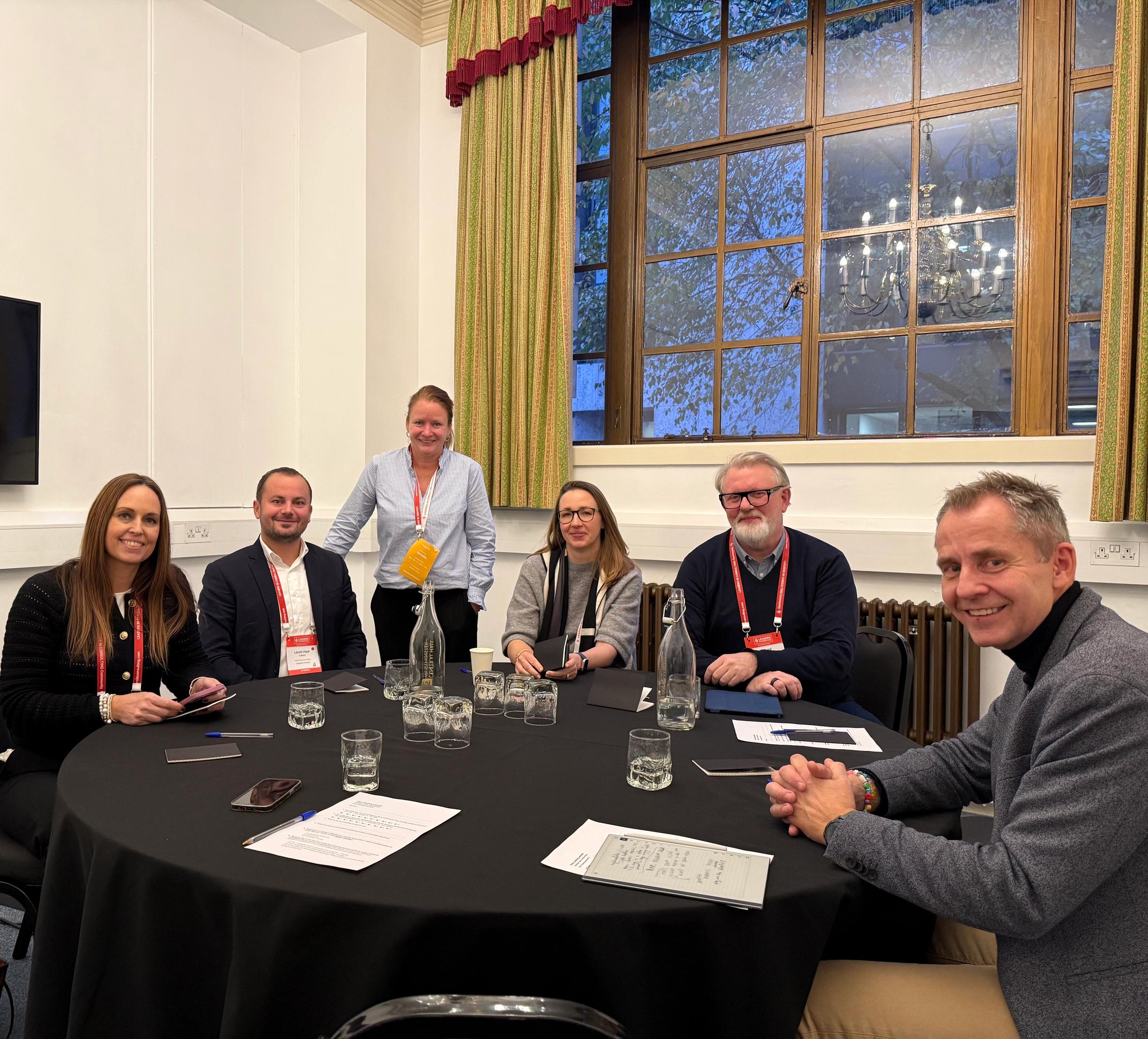 Consulting leaders engaging in a hands-on strategy session at Leaders in Consulting Conference 2025, discussing real-world business growth challenges