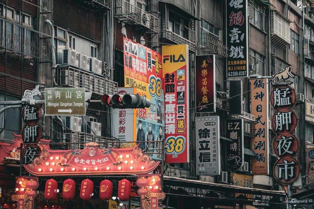 Busy street with many signs and red lanterns