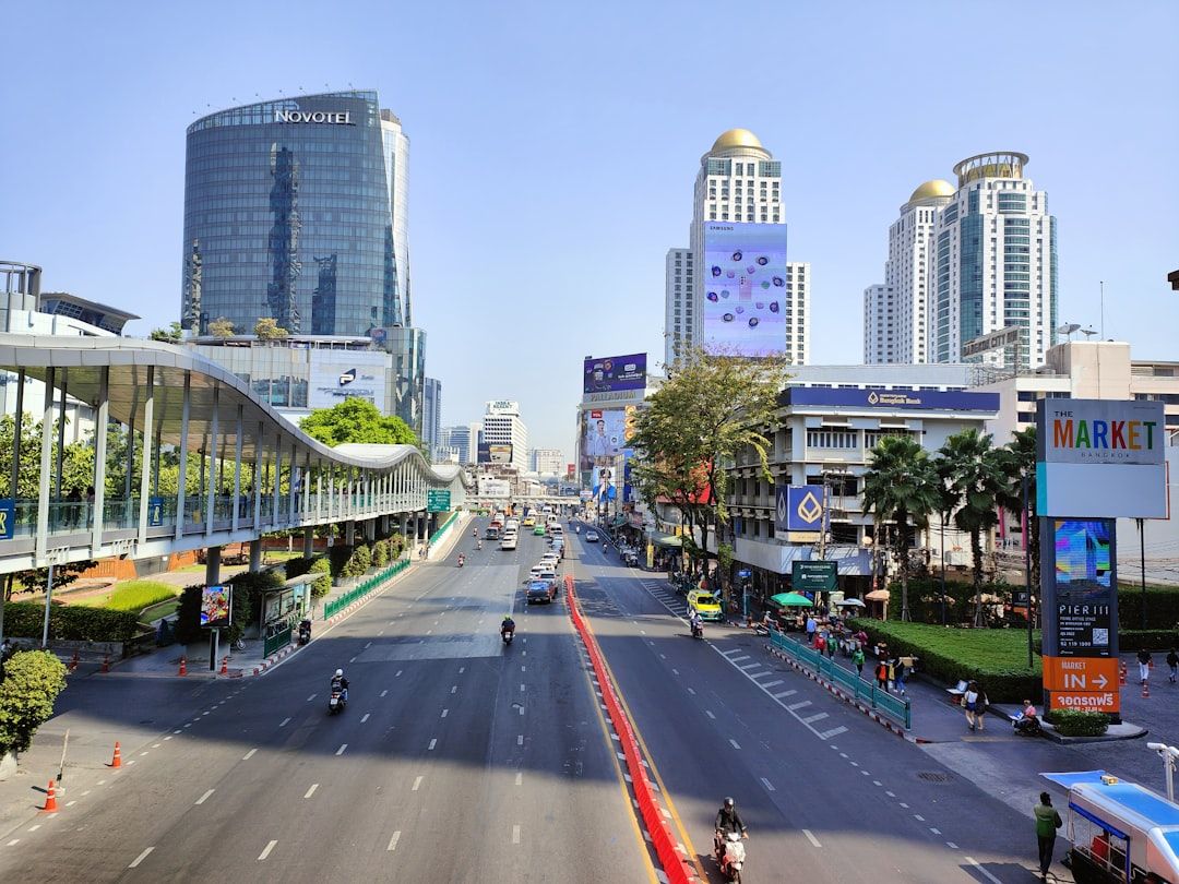 a view of a city street with tall buildings in the background