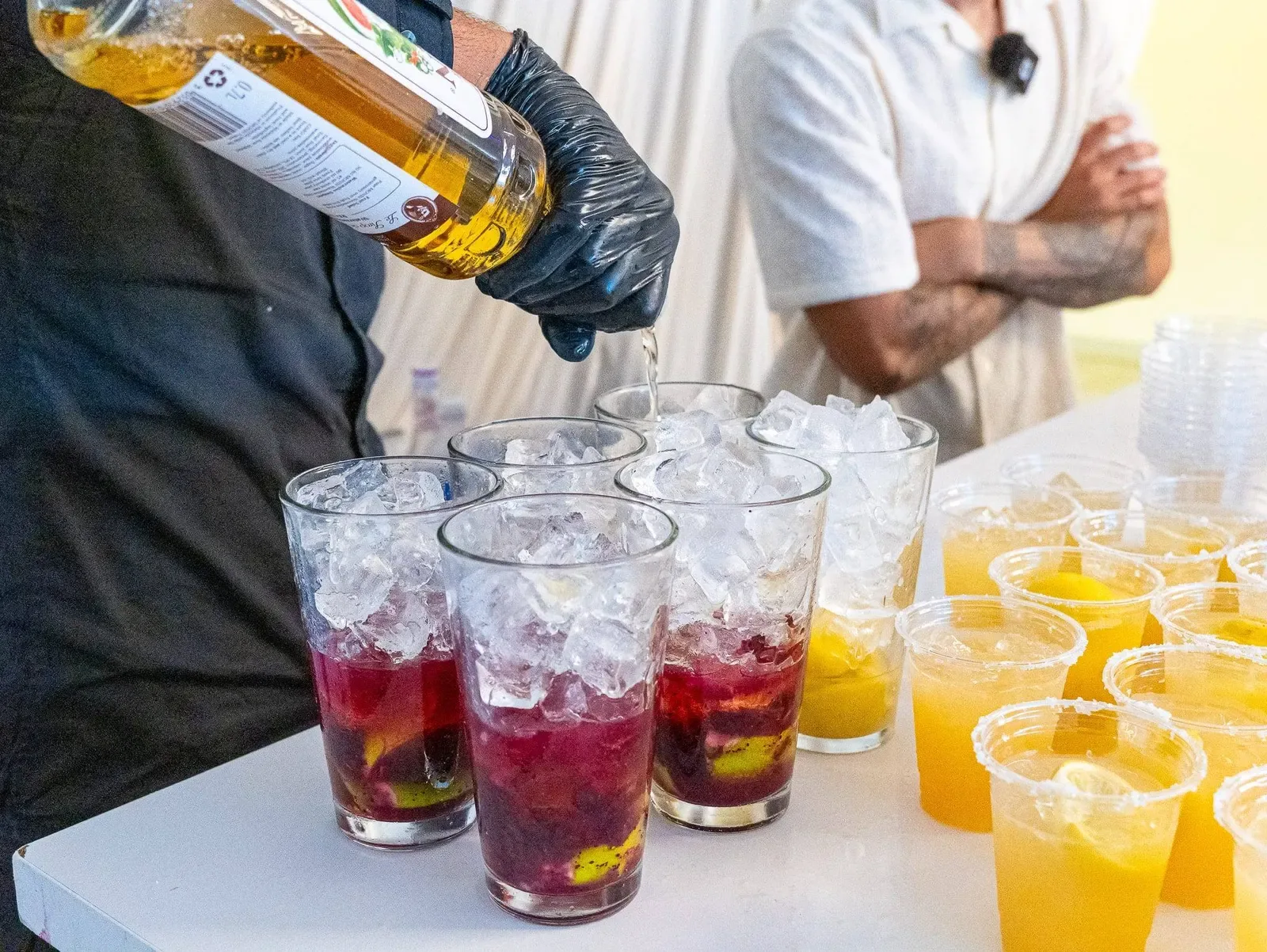 Drinks being poured behind a bar