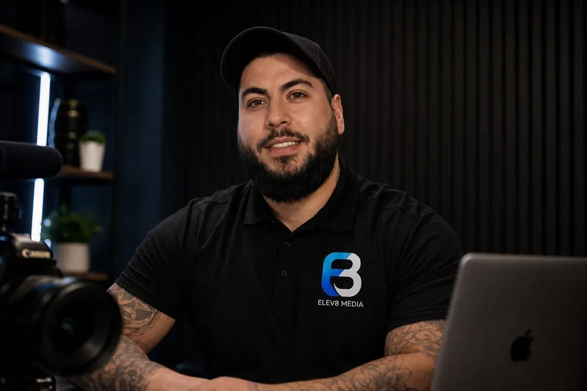 Hussein, founder of Elev8 Media, holding a camera