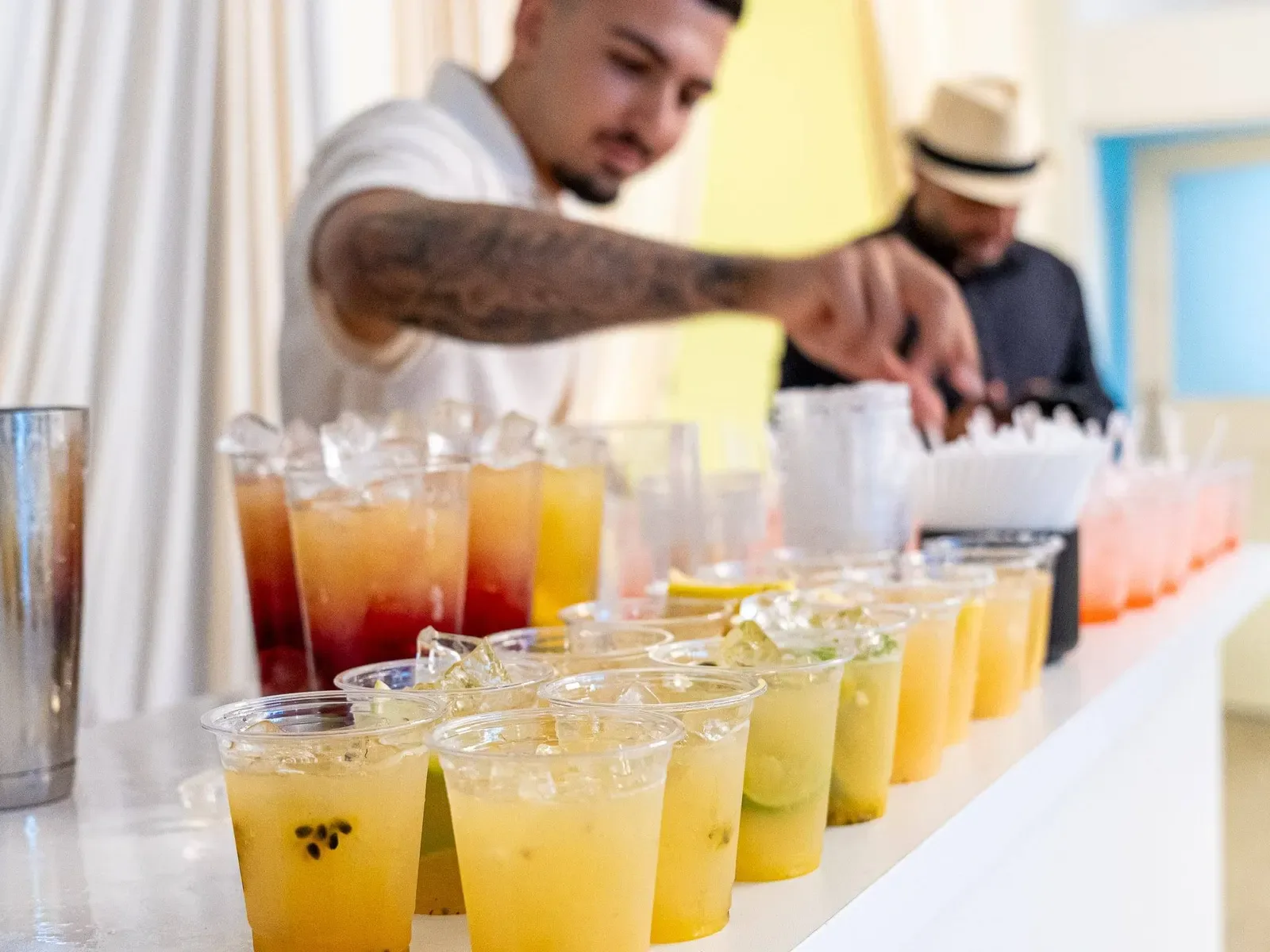 A bartender serving drinks at an event