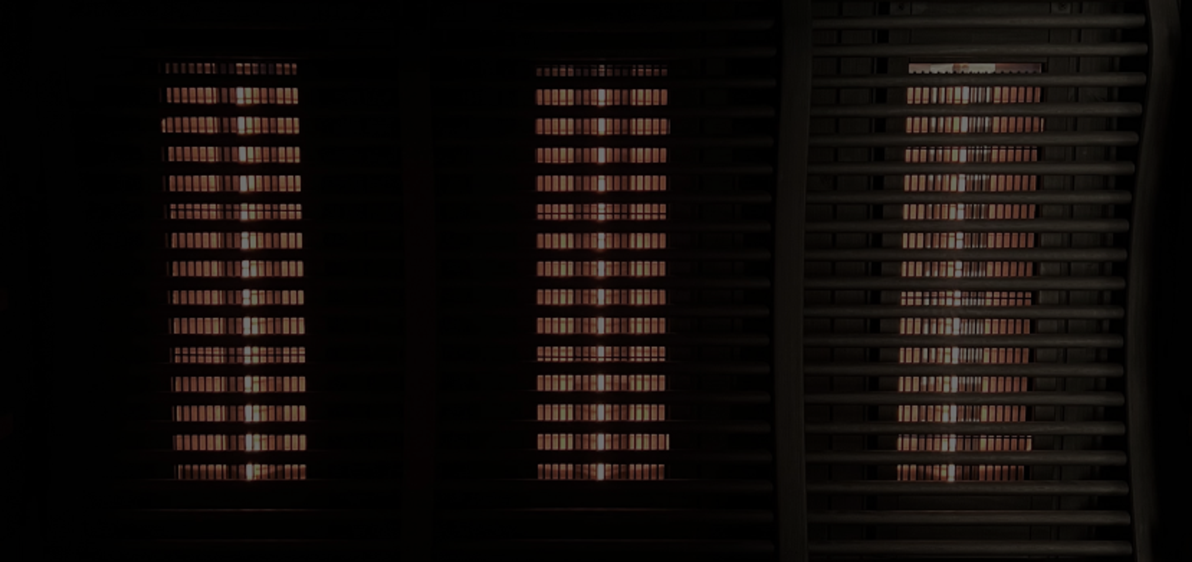 Three columns of red light from an infrared sauna