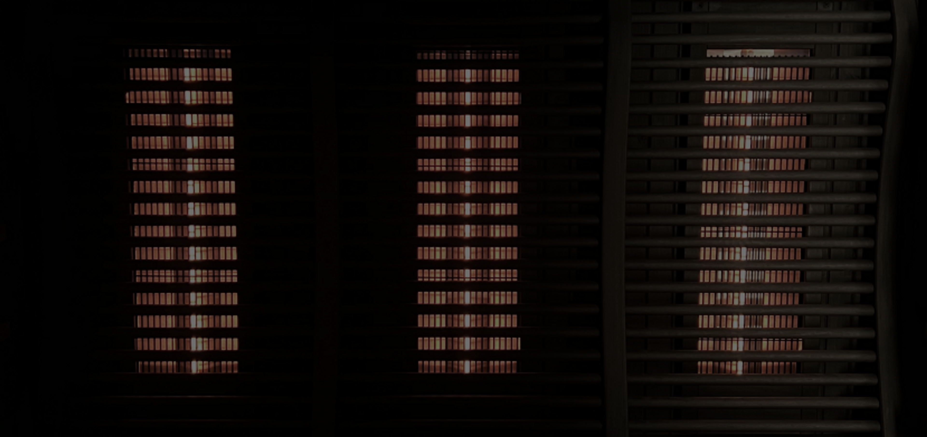Three columns of red light from an infrared sauna
