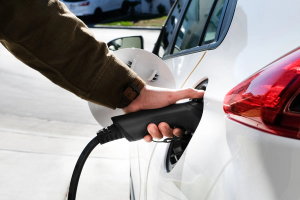 Plug charging an electric vehicle