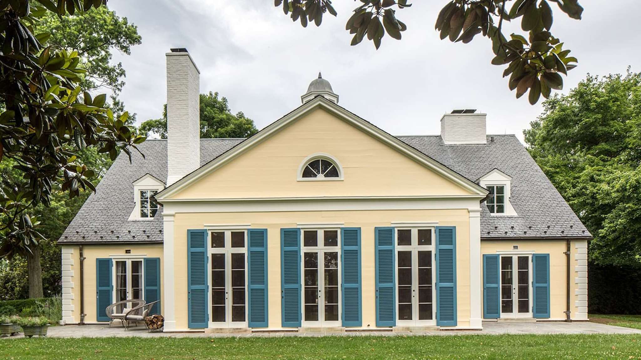 Yellow estate with blue shuttersundefined