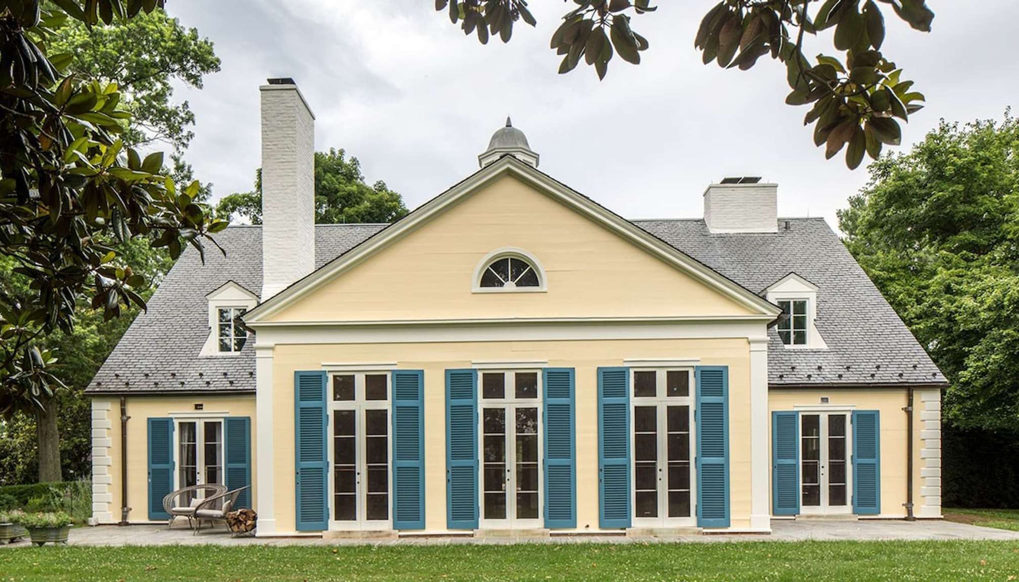 Yellow estate with blue shuttersundefined