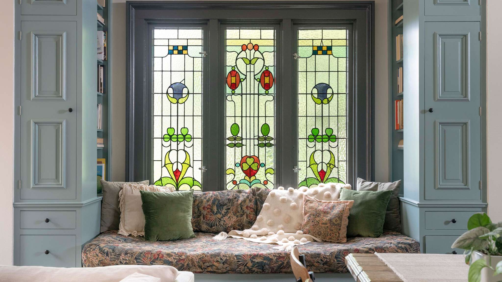 Window seat with stain glass windows and bookcasesundefined
