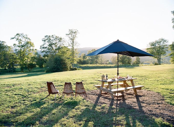 chairs and umbrella with mountain view