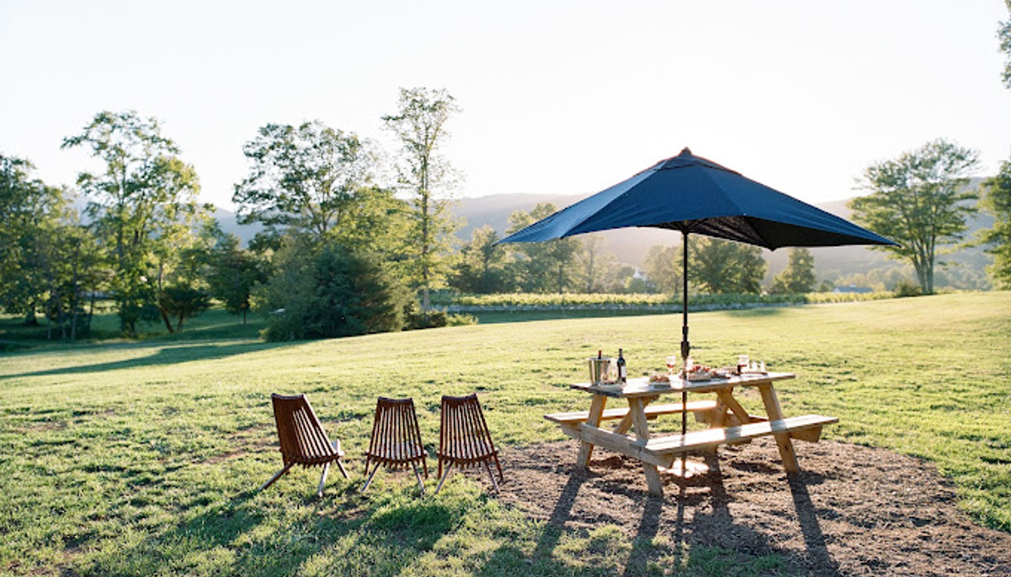 chairs and umbrella with mountain view