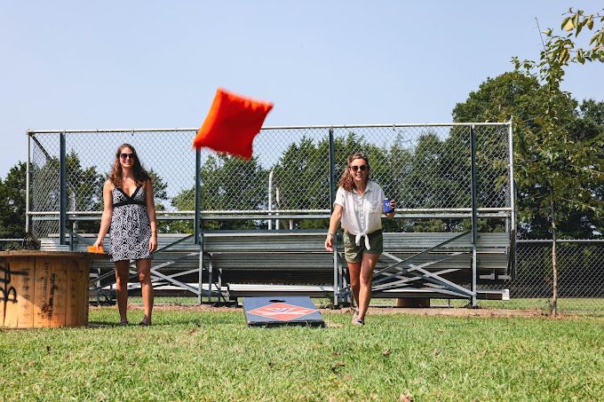 ladies playing cornhole at Patch Brewing