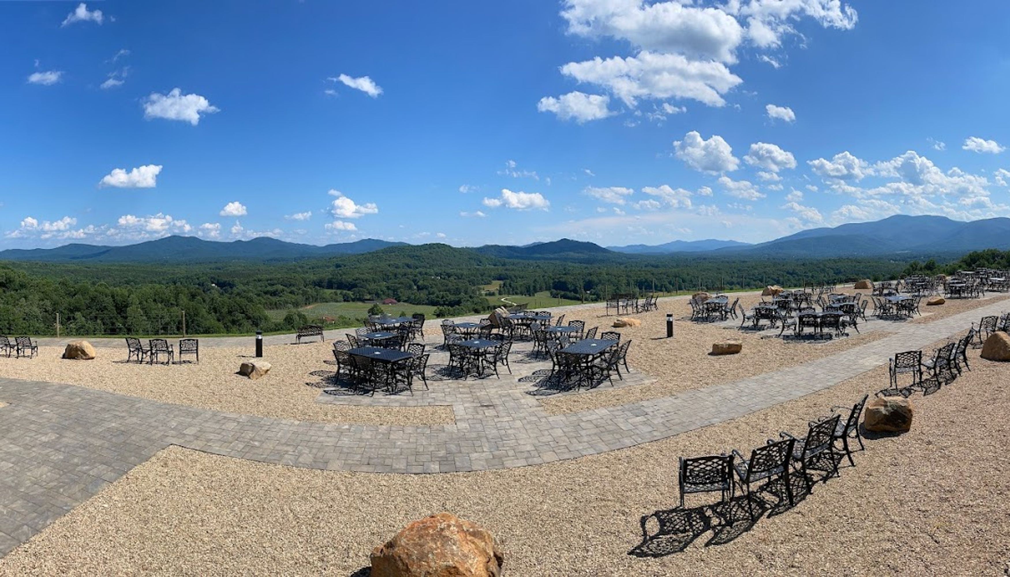 patio furniture in front of mountain view