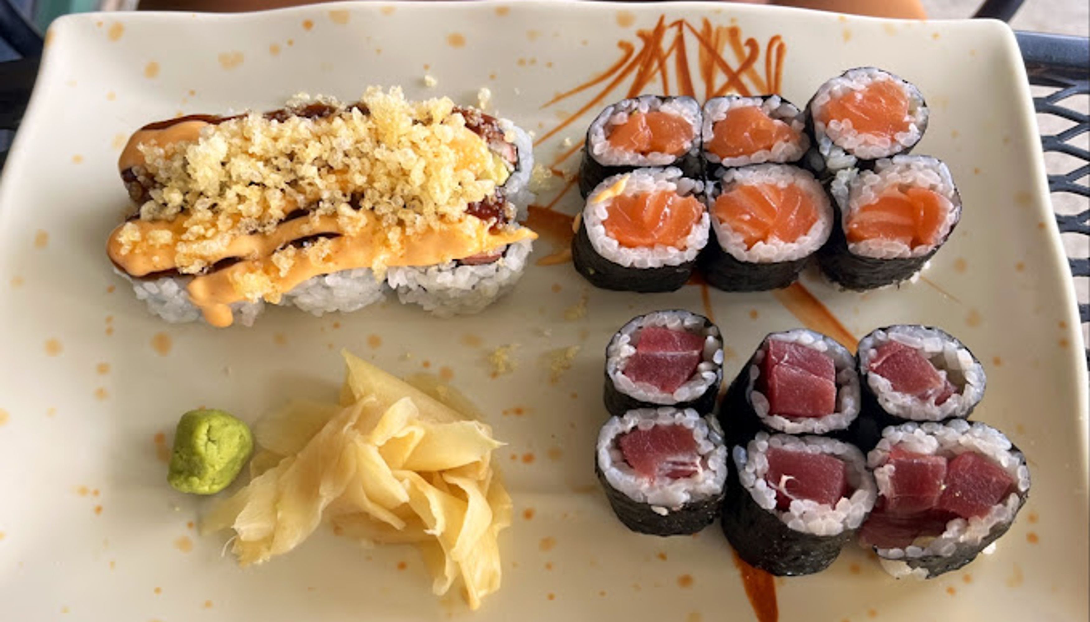 3 different kinds of sushi rolls on a plateundefined