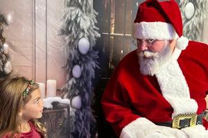 little girl visiting with Santa