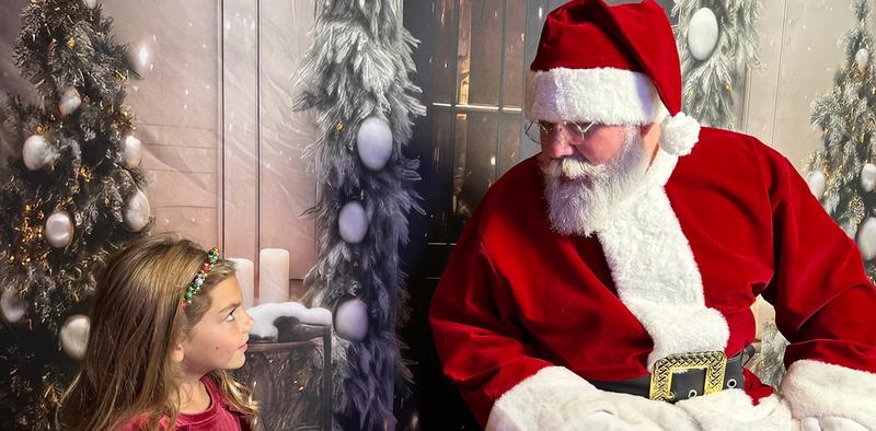 little girl visiting with Santa