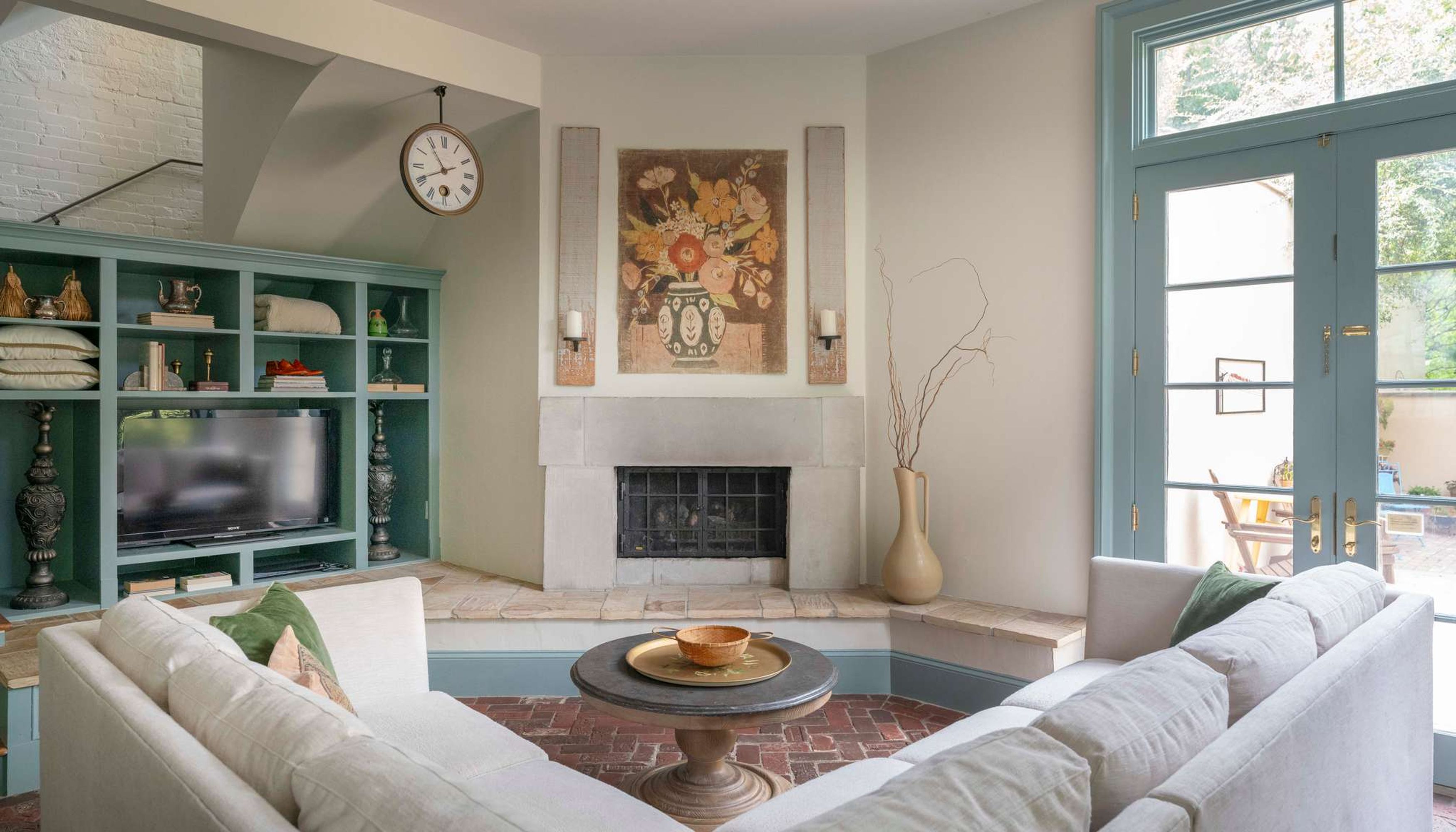 Living room with large couch, fireplace, and tv