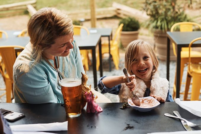 Kid eating ice cream at Three Notch'dundefined