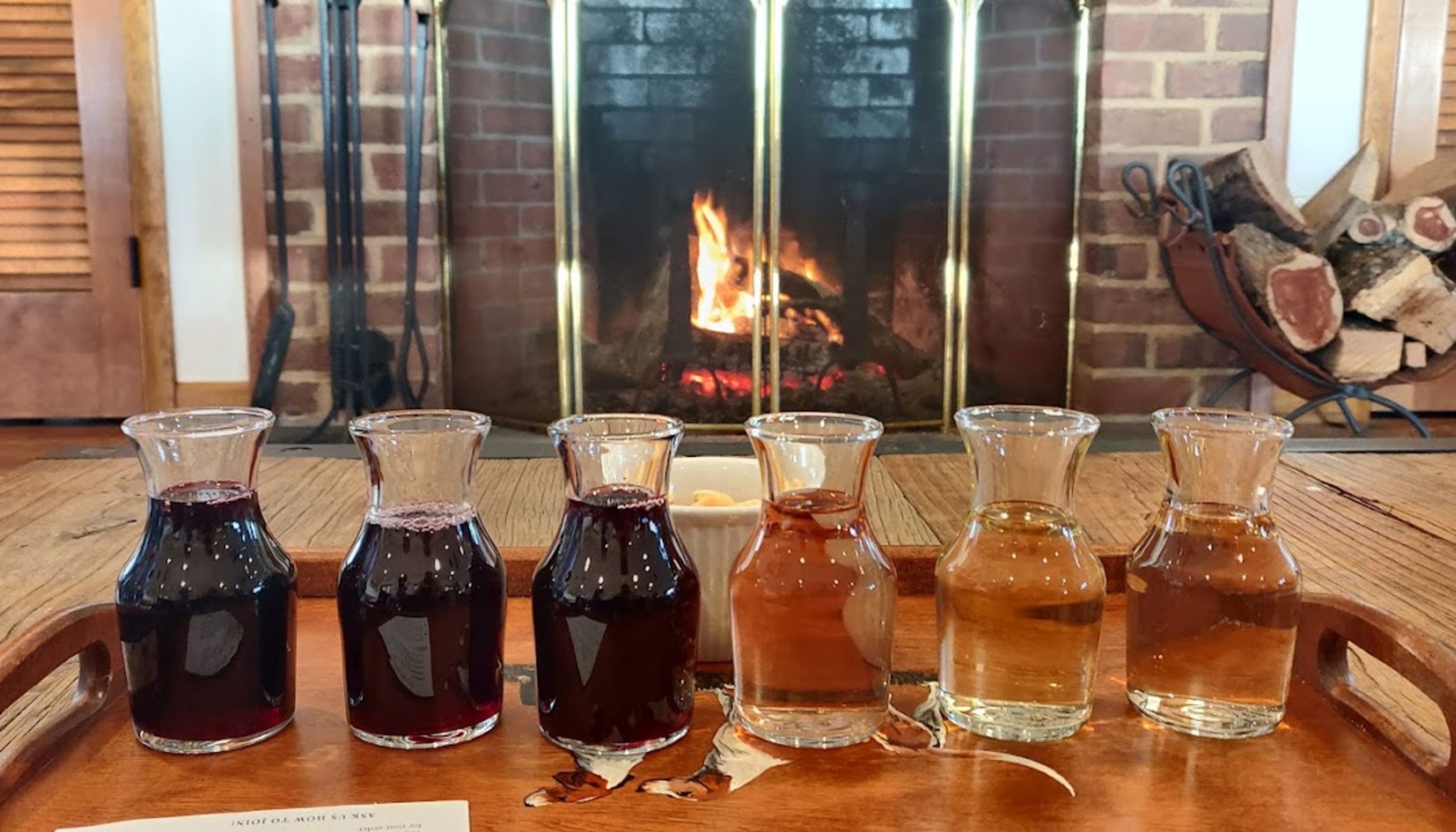 Wine tasting in front of fire placeundefined