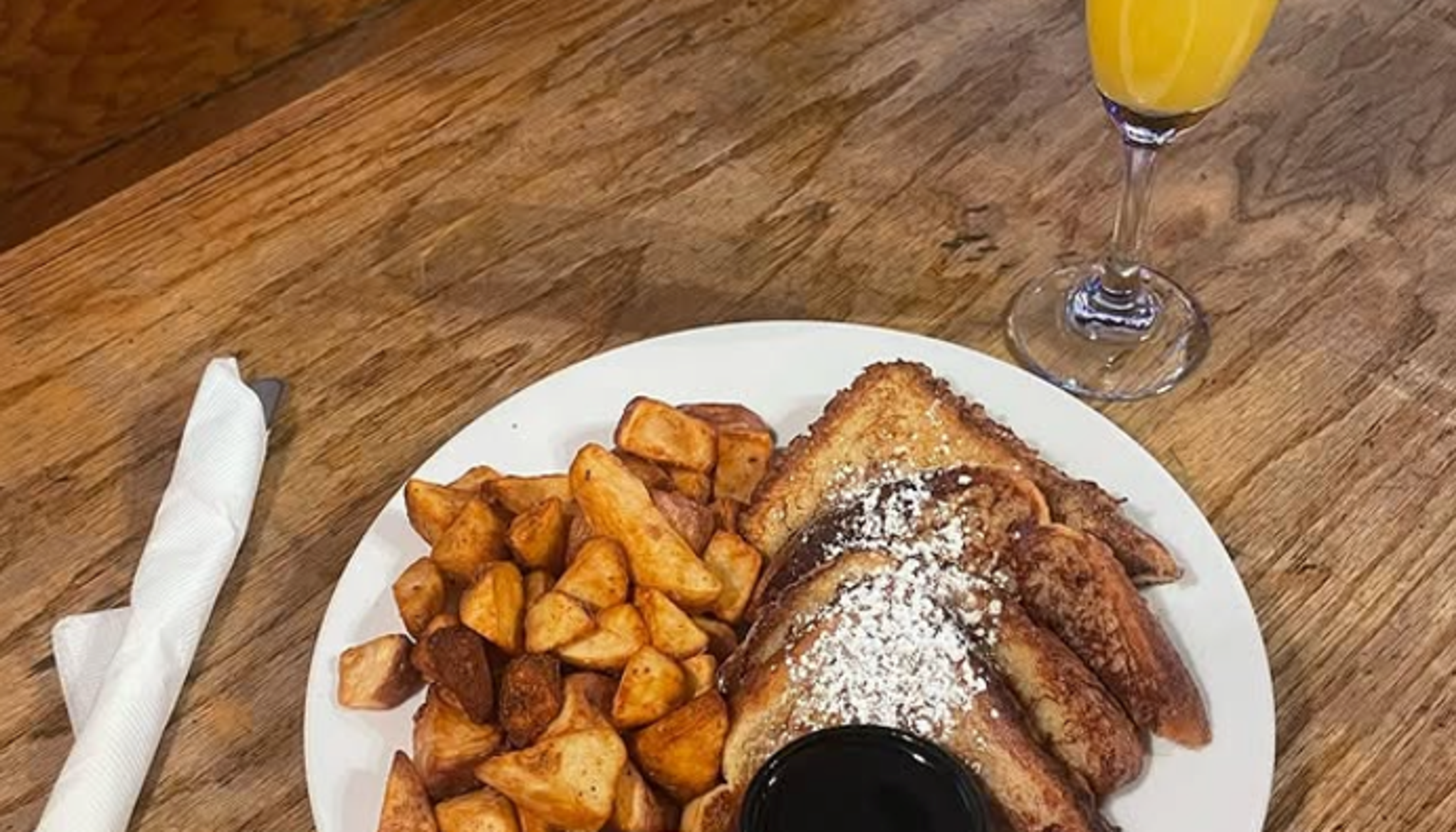 french toast and potatos on a plateundefined