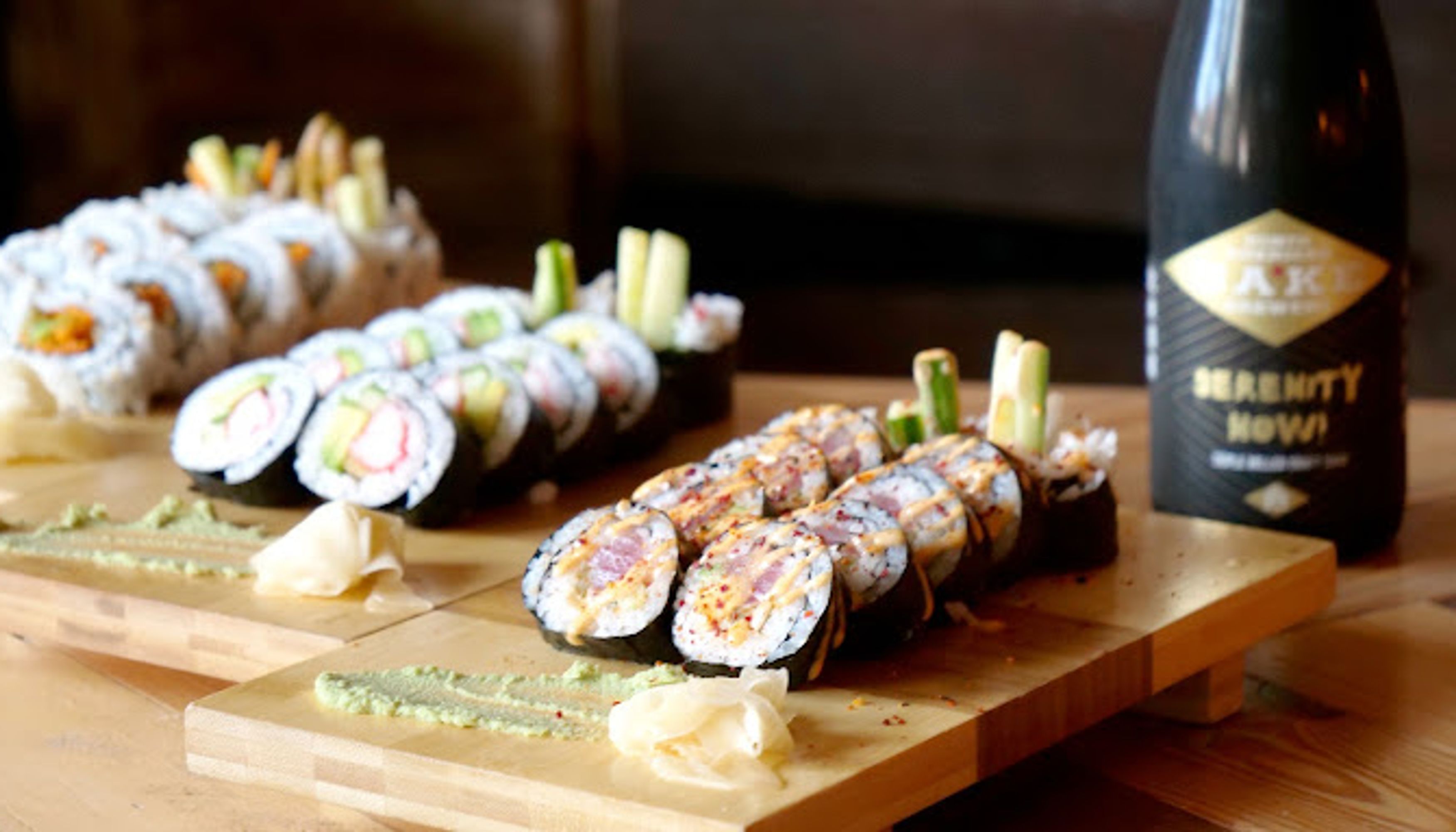 3 plates of sushi rollsundefined