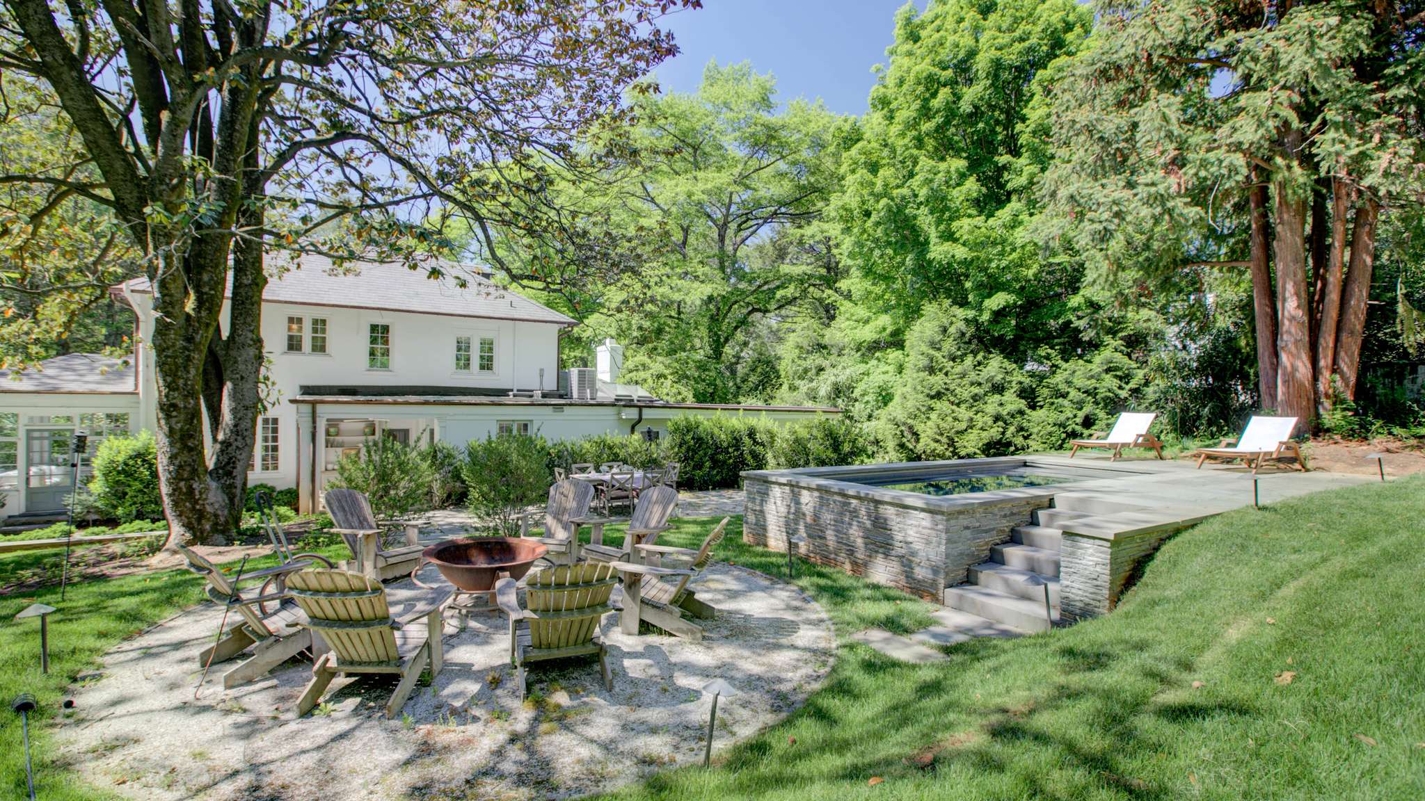 Backyard with firepit and pool