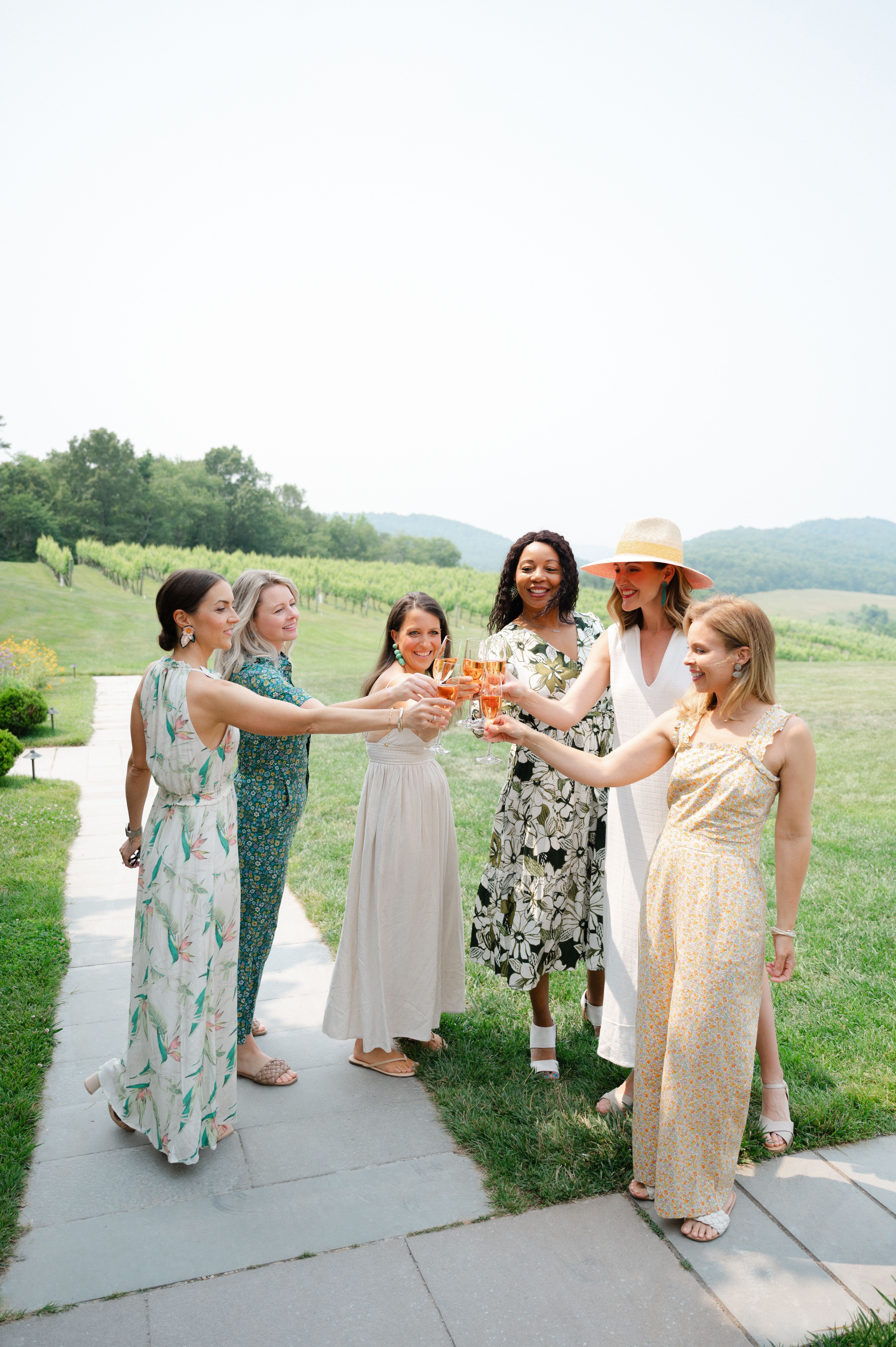 women toasting wine glasses