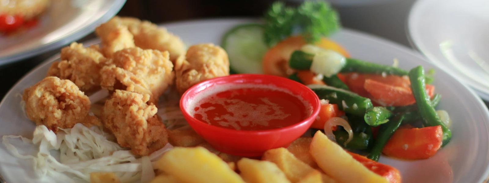 Fried shrimp, french fries and salad