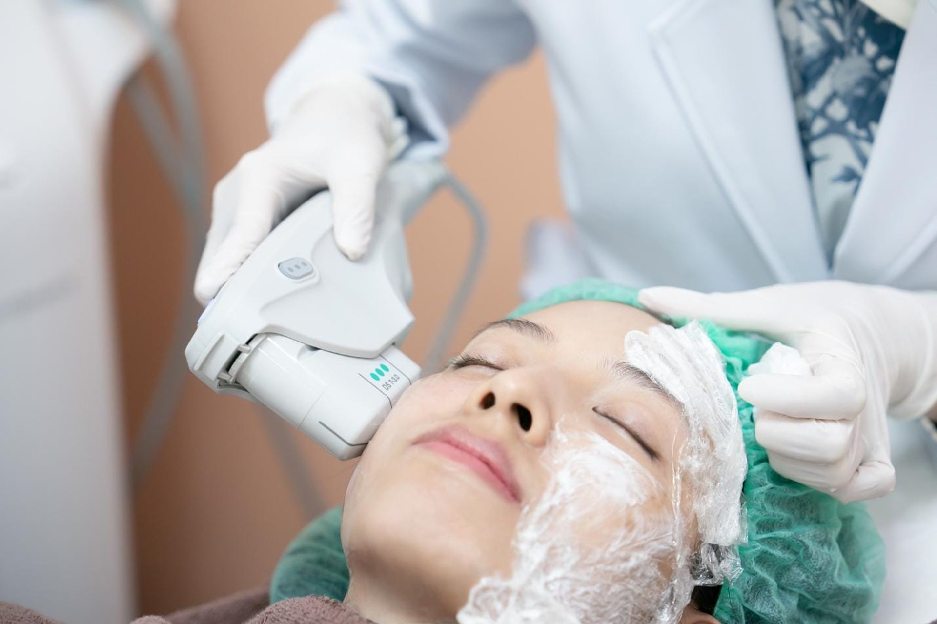 HIFU skin-tightening device applied to a patient's face