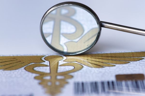 A magnifying glass over a bar code