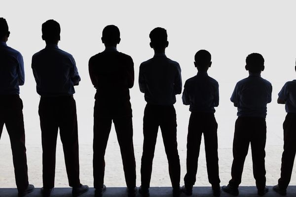 A group of people standing next to each other