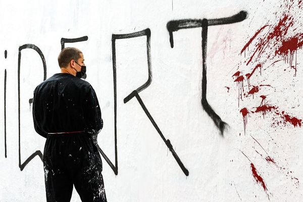 a person looking at a drawing
