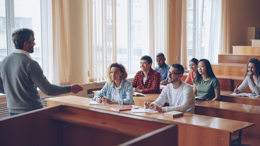 Professor teaching students in a lecture hall.