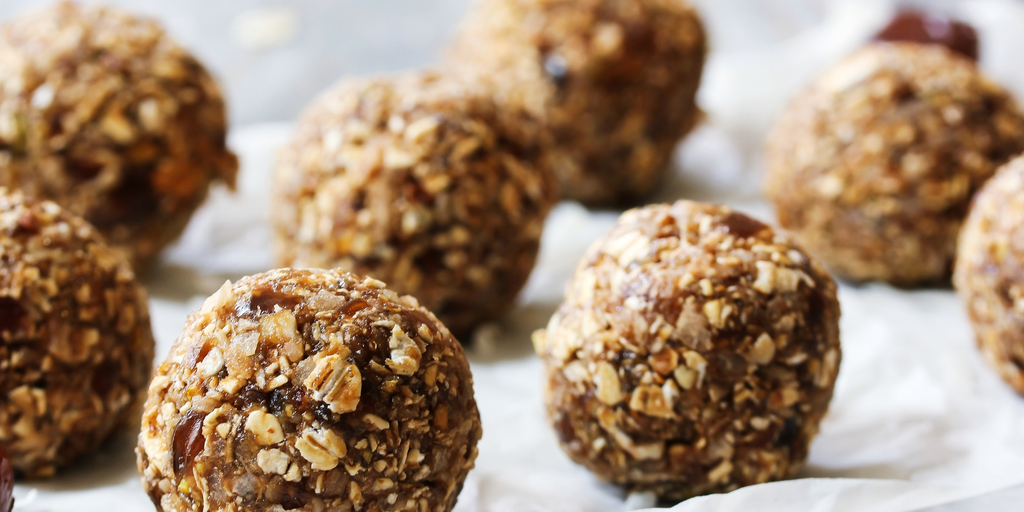 Image of the oats and other ingredients rolled into balls on a white cloth.
