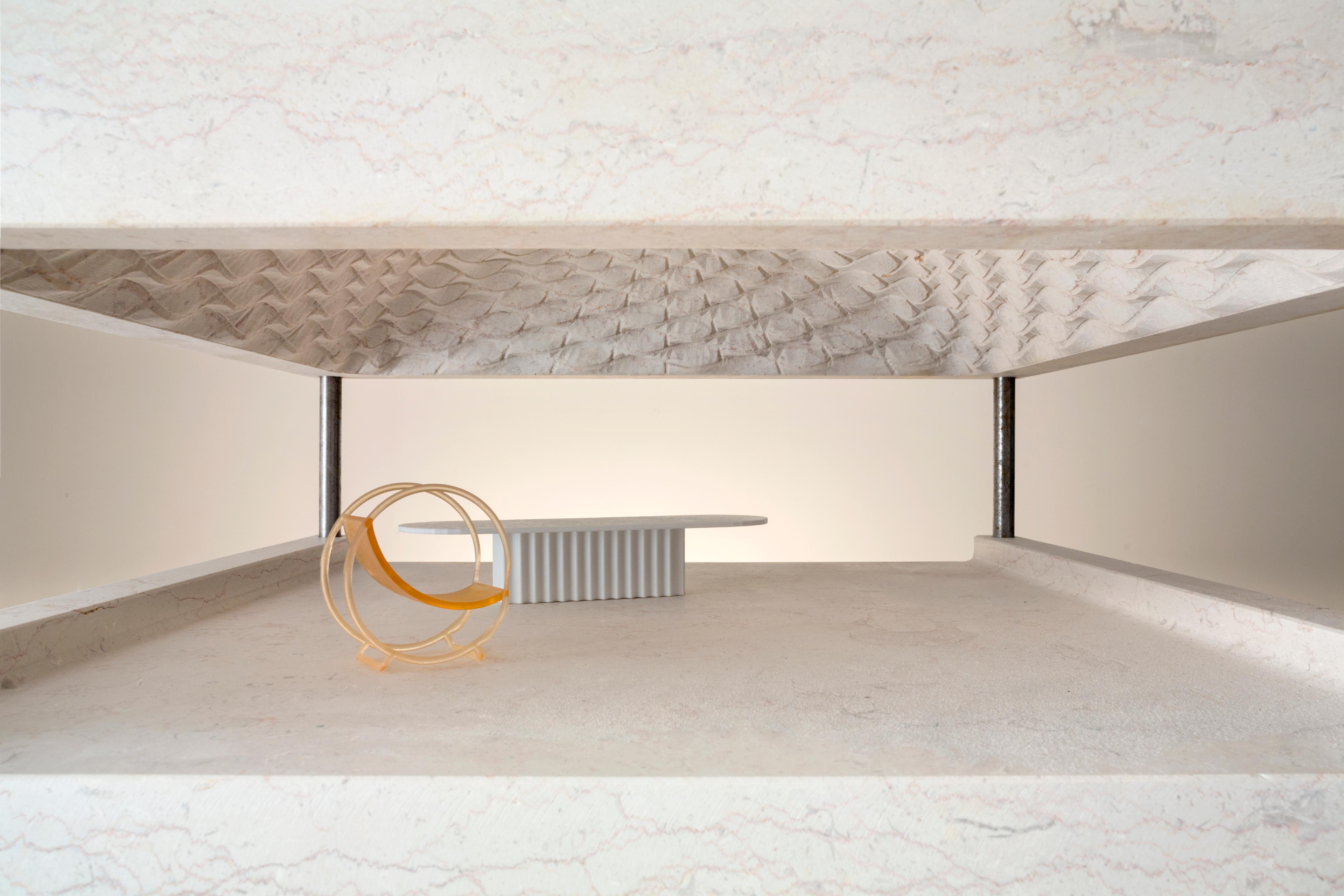 Photo of a stone model of the MMAG building