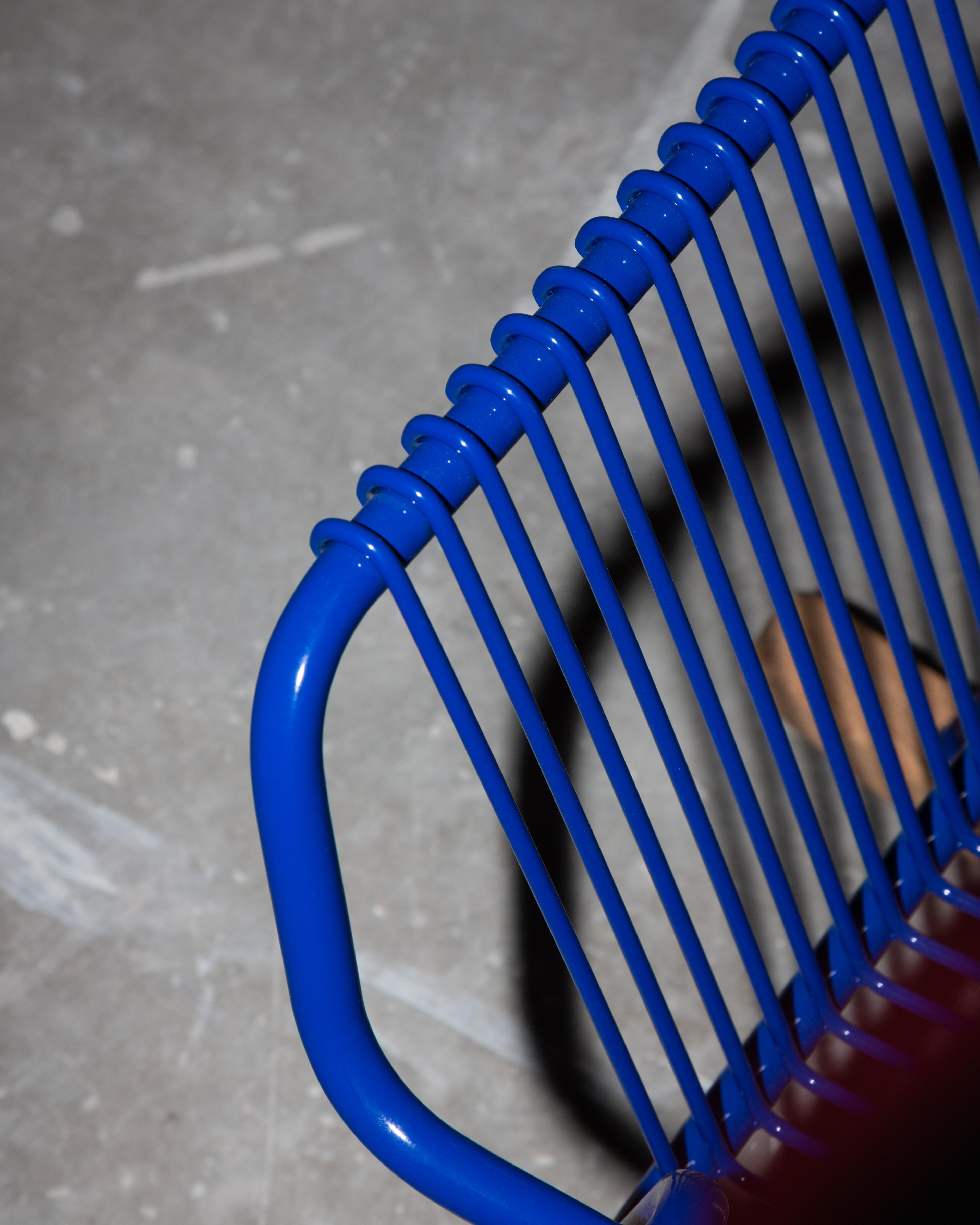 Closeup photograph of blue chair backrest
