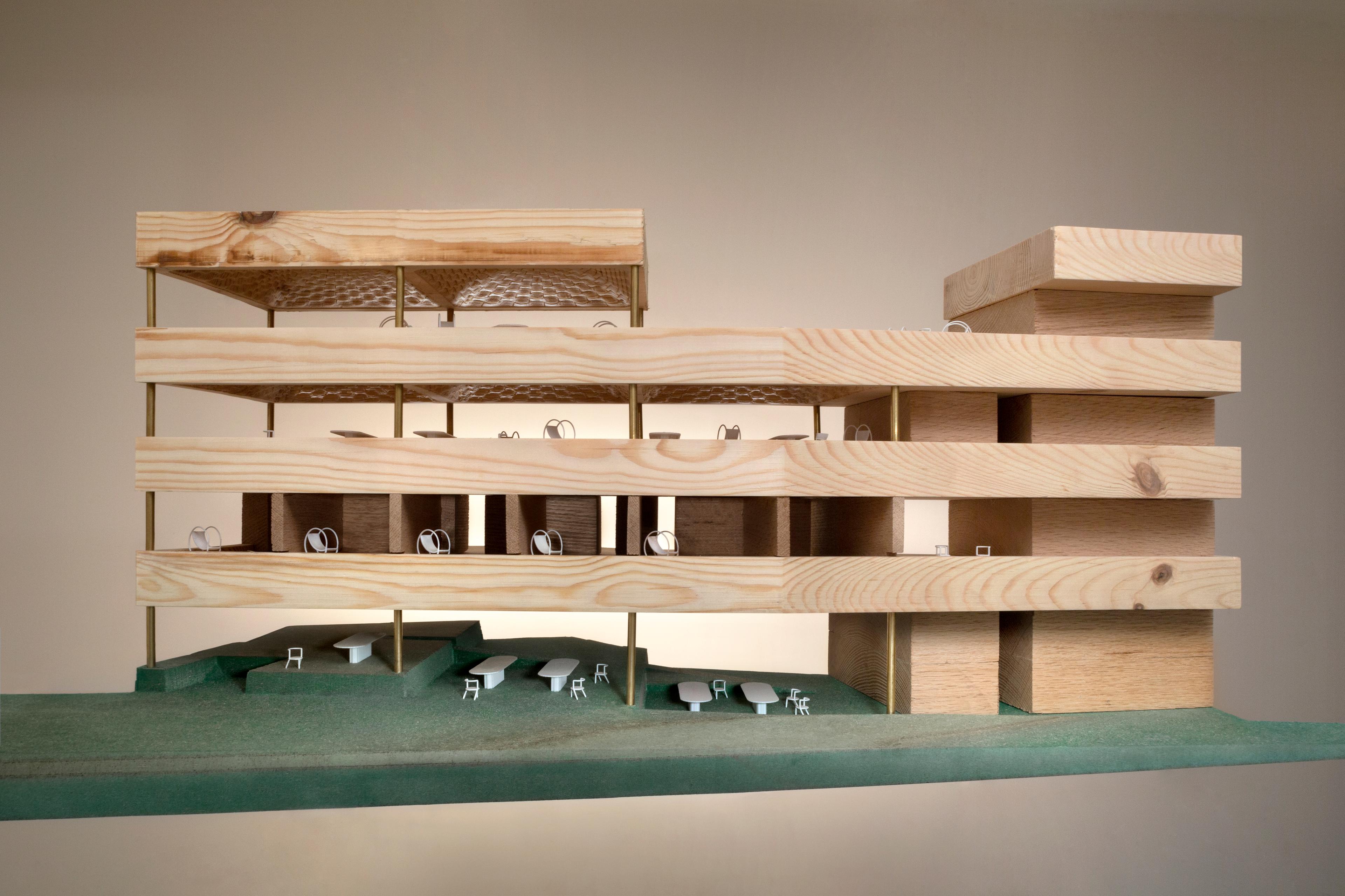 Photo of a wood model of the MMAG building