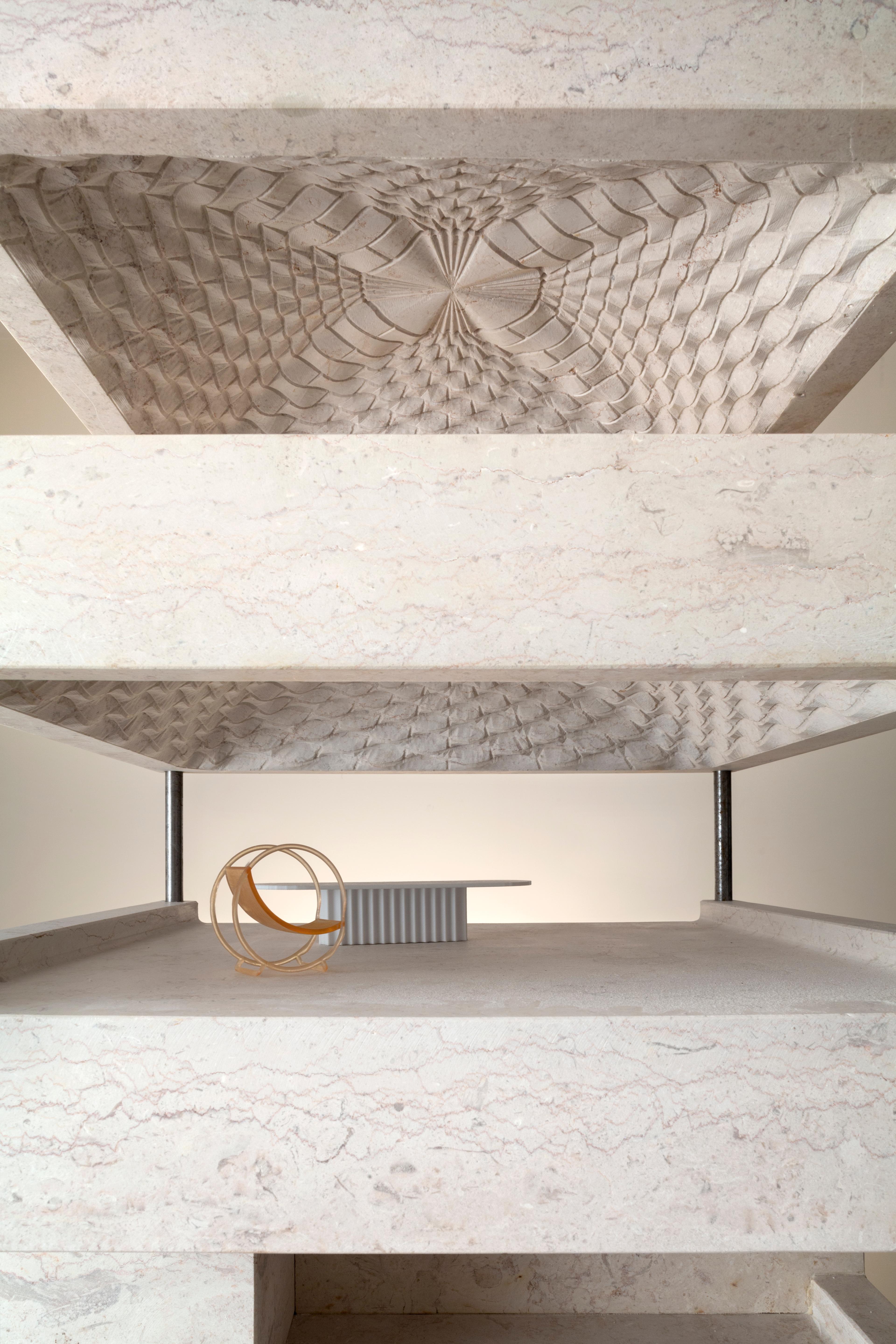 Photo of a stone model of the MMAG building