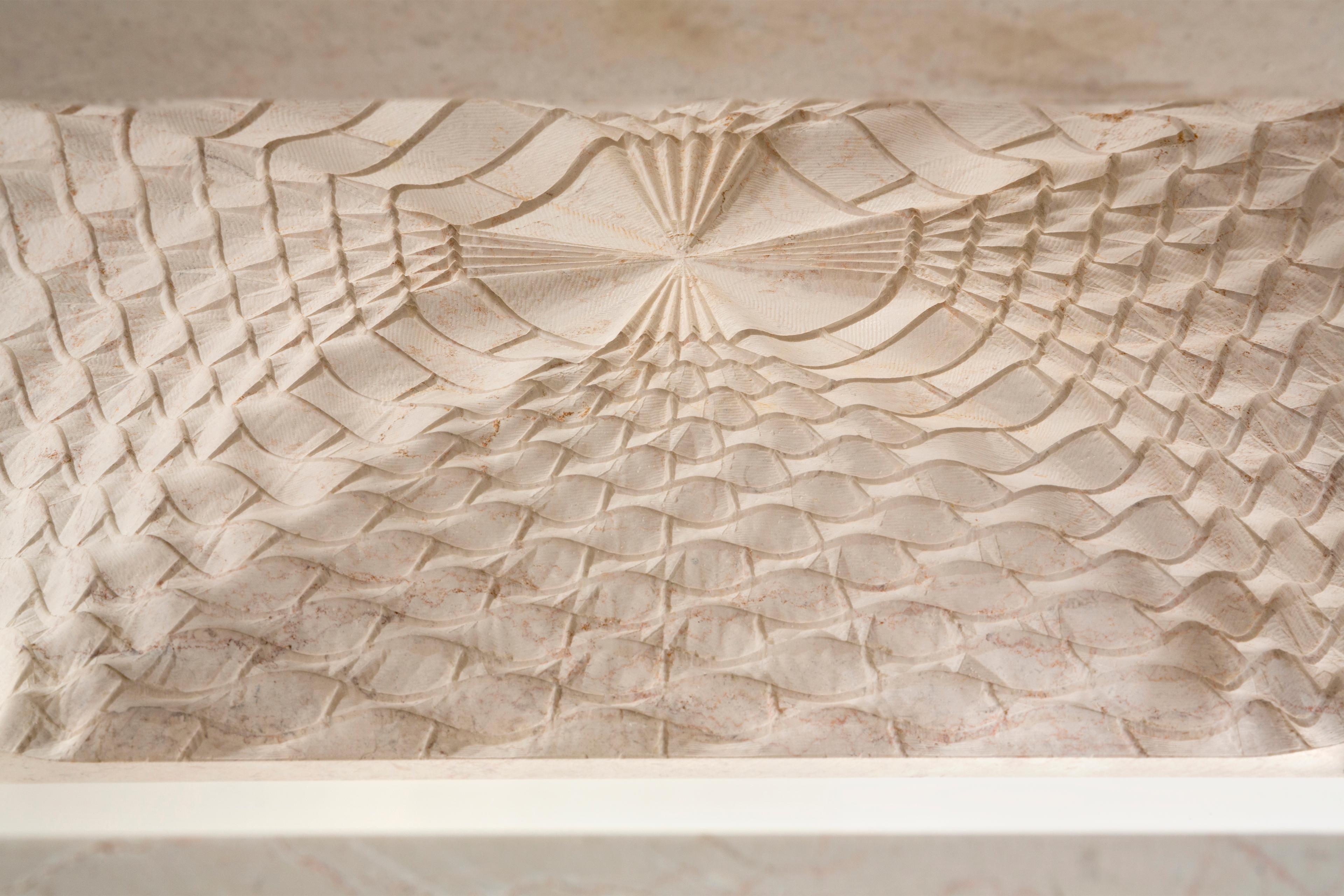 Photo of a stone model of the MMAG building