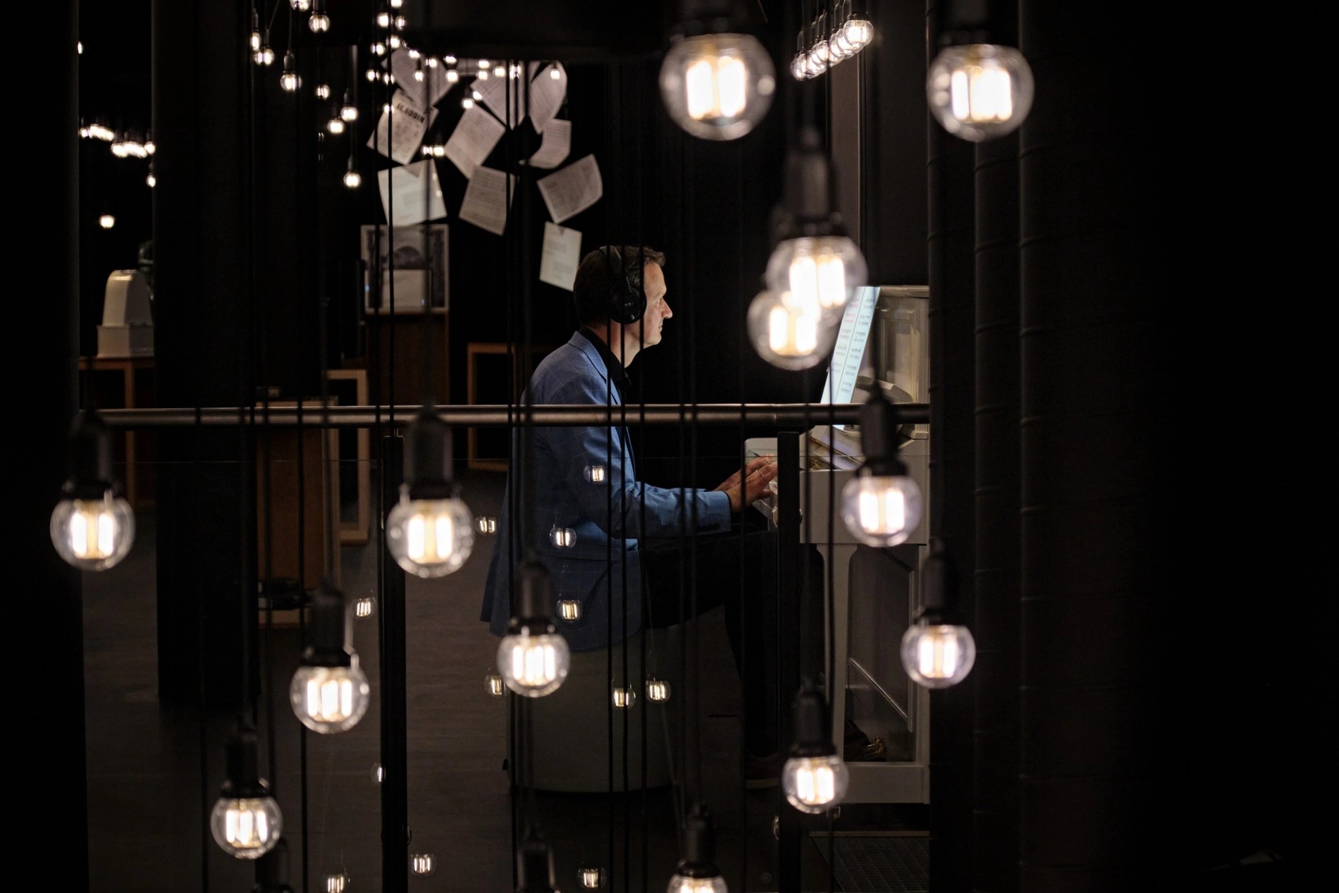 A visitor engages with a piano interactive in the Exploration section at the Carl Nielsen Museet. Sound by Coda to Coda