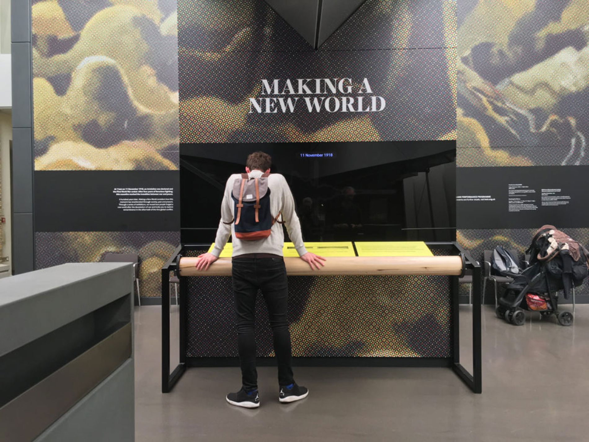 Image showing a person looking at the Armistice soundwave installation. Installation Composer and Design by Coda to Coda.