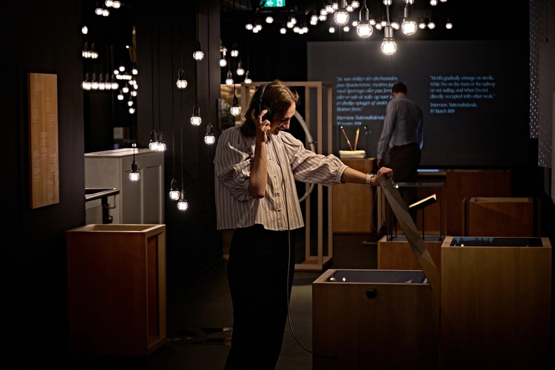 A person experiences an interactive display in the Exploration section of the Carl Nielsen Museet. Sound by Coda to Coda