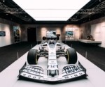 A white Formula 1 car on a raised platform at Formula 1 Exhibition. Soundscape by Coda to Coda