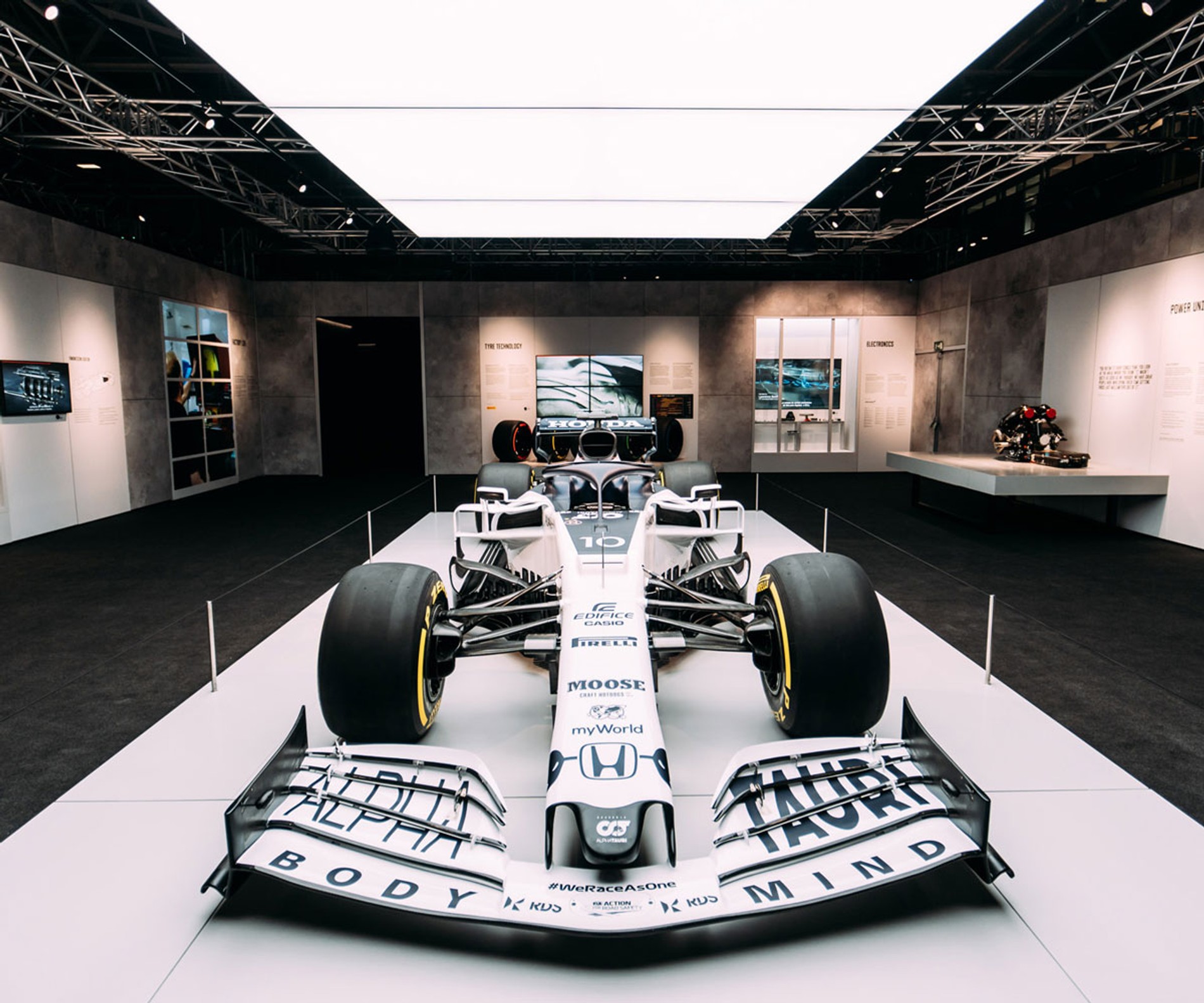 A white Formula 1 car on a raised platform at Formula 1 Exhibition. Soundscape by Coda to Coda